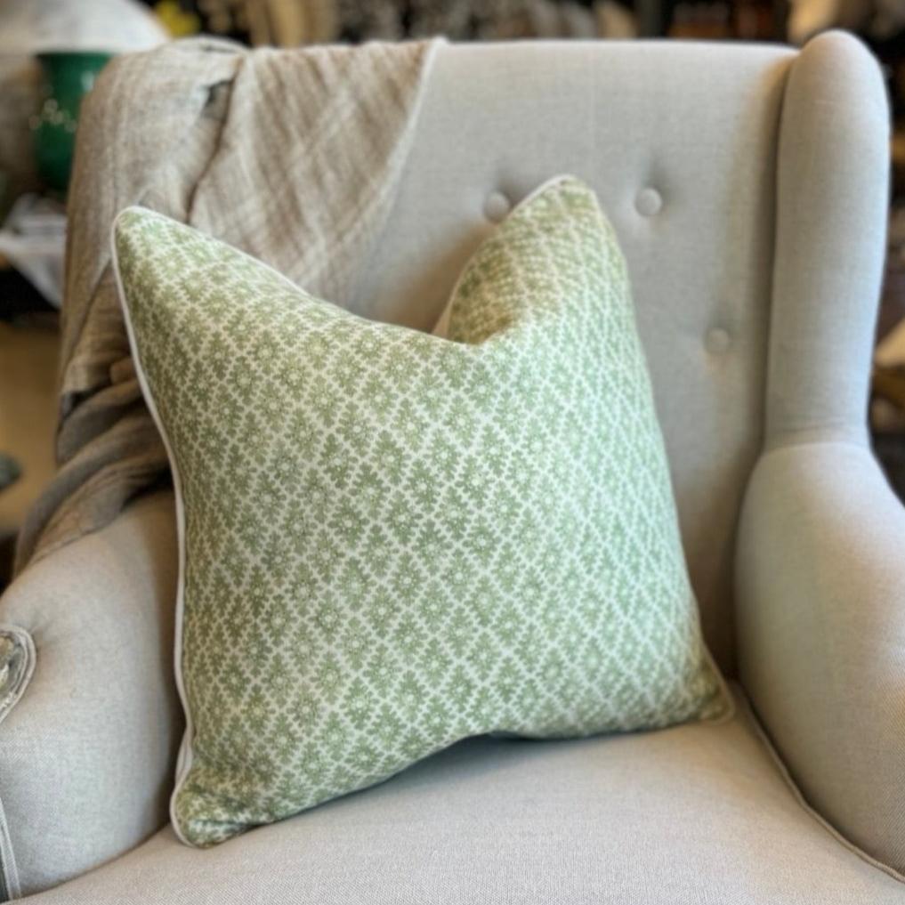 Add sophistication to your space with Amelie Green Cushion. The intricate green pattern on an ivory backdrop creates an elegant look. The reverse side showcases ivory and the cushion is completed with ivory self-piping. Additionally, the feather insert ensures maximum comfort.