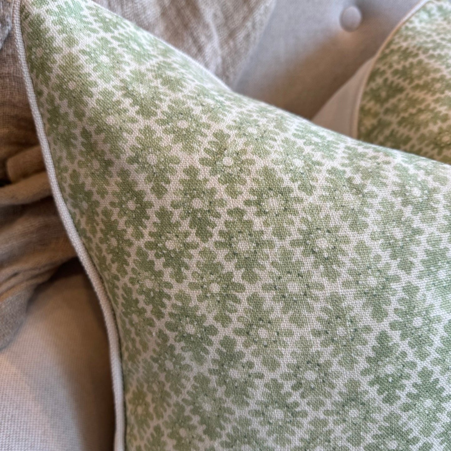 Add sophistication to your space with Amelie Green Cushion. The intricate green pattern on an ivory backdrop creates an elegant look. The reverse side showcases ivory and the cushion is completed with ivory self-piping. Additionally, the feather insert ensures maximum comfort.