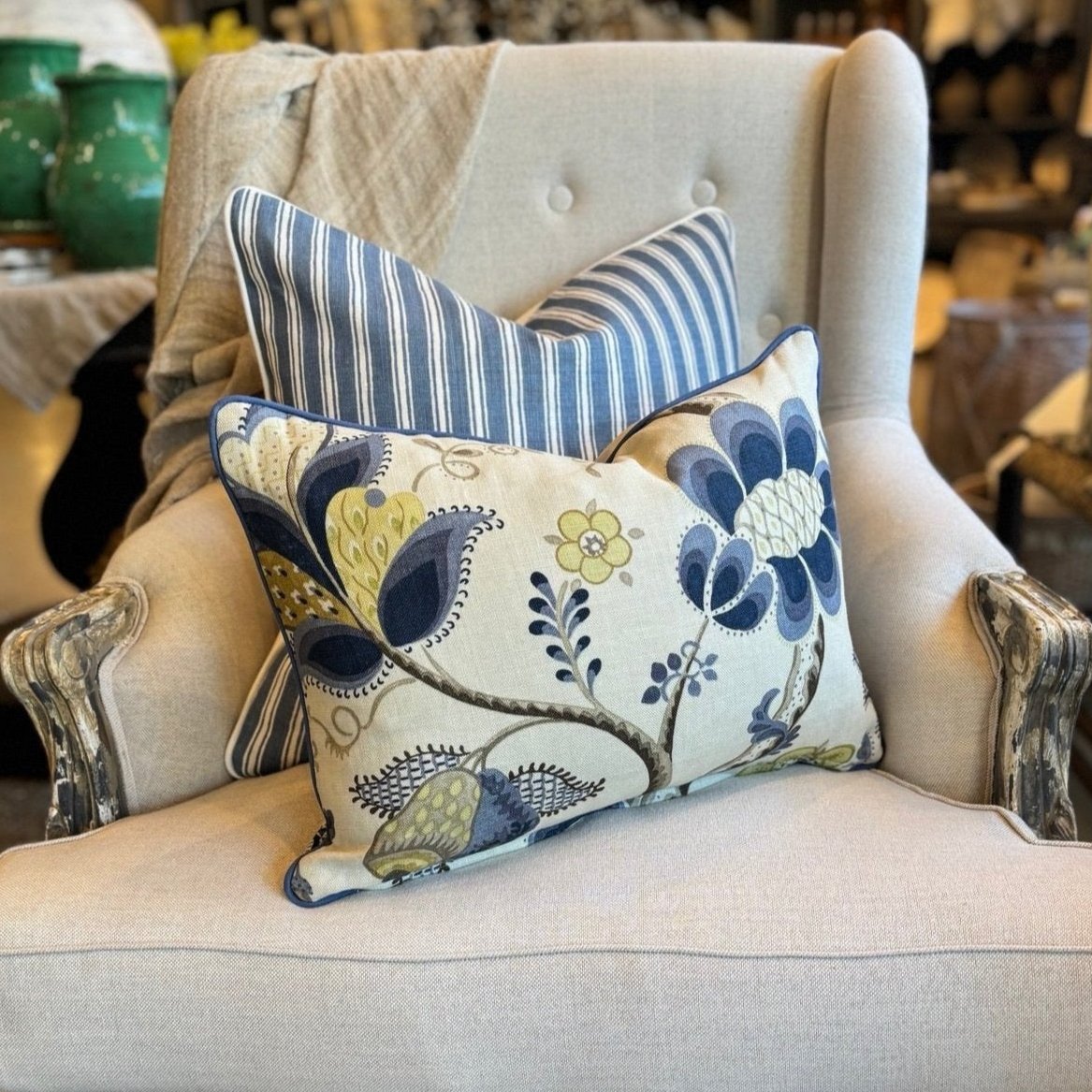 Indulge in the exquisite texture of the meticulously made Sophia Floral Heavyweight Cushion. This cushion boasts a stunning blue and green floral pattern on a neutral backdrop, and includes a plush feather insert for unparalleled coziness. The back is enhanced with oatmeal linen for a sophisticated touch.