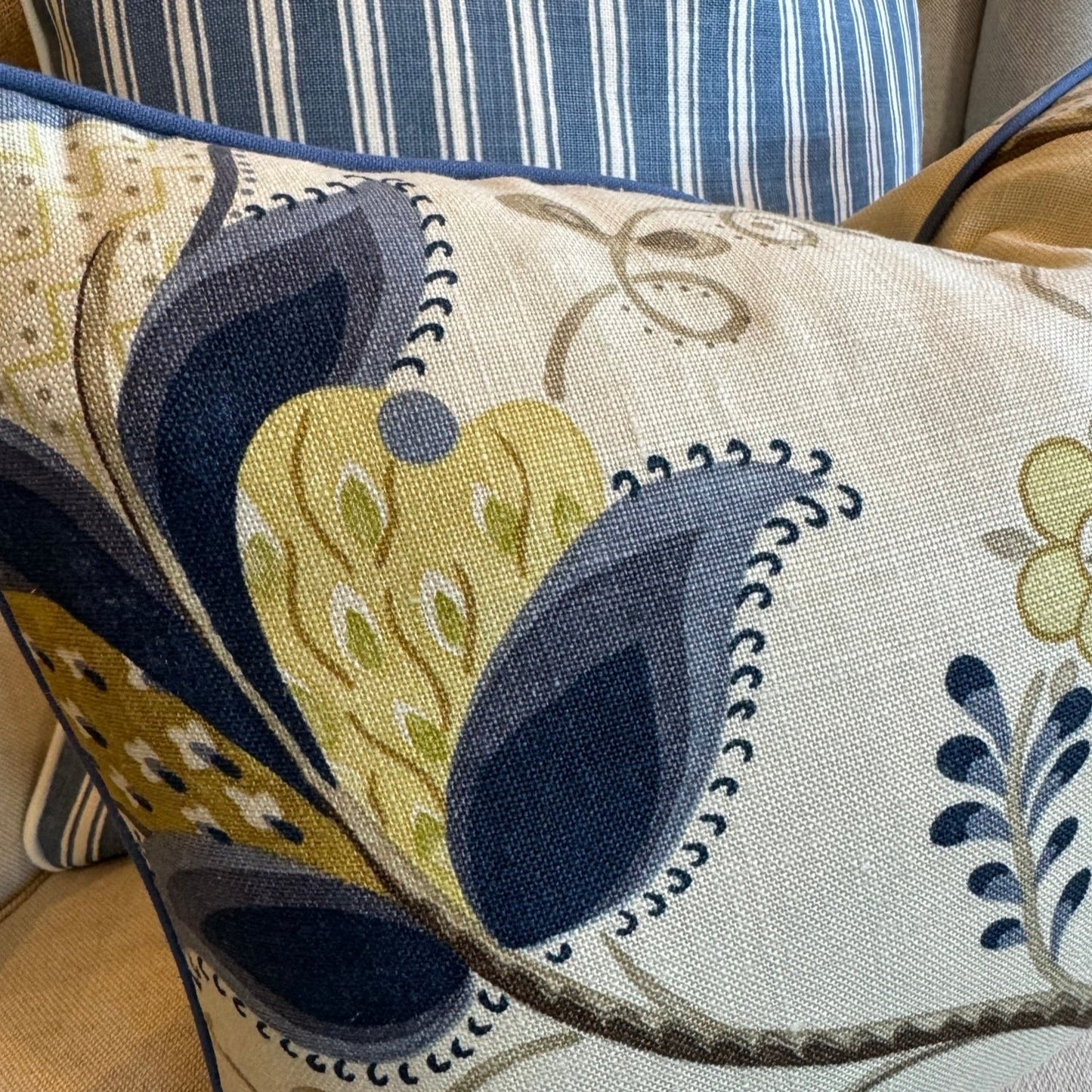 Indulge in the exquisite texture of the meticulously made Sophia Floral Heavyweight Cushion. This cushion boasts a stunning blue and green floral pattern on a neutral backdrop, and includes a plush feather insert for unparalleled coziness. The back is enhanced with oatmeal linen for a sophisticated touch.