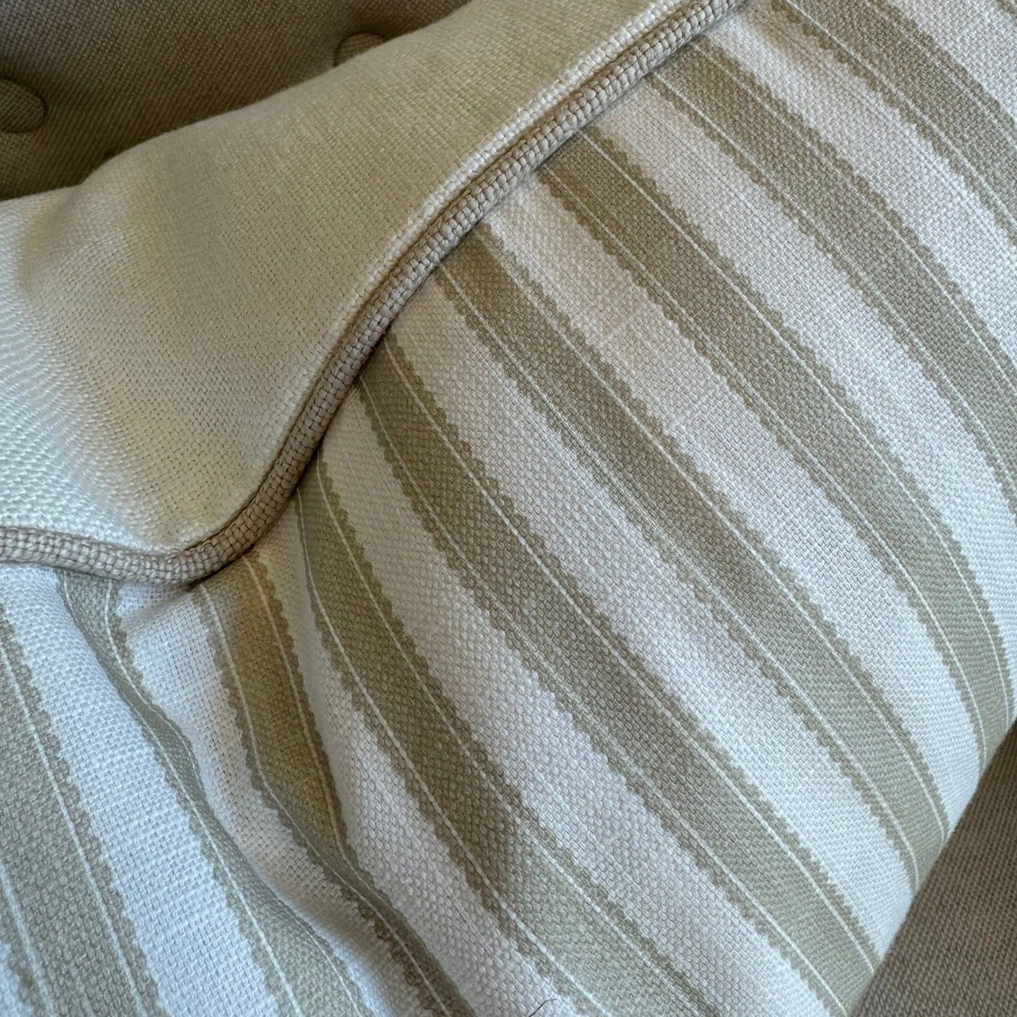Indulge in the luxurious feel of our Striped Pale Olive & Ivory Lumbar Cushion crafted from a sumptuous heavyweight fabric. The pale olive stripe against ivory background exudes timeless elegance and grace, making it the perfect addition to any sophisticated home decor. Comes with a luxurious feather insert for added comfort.