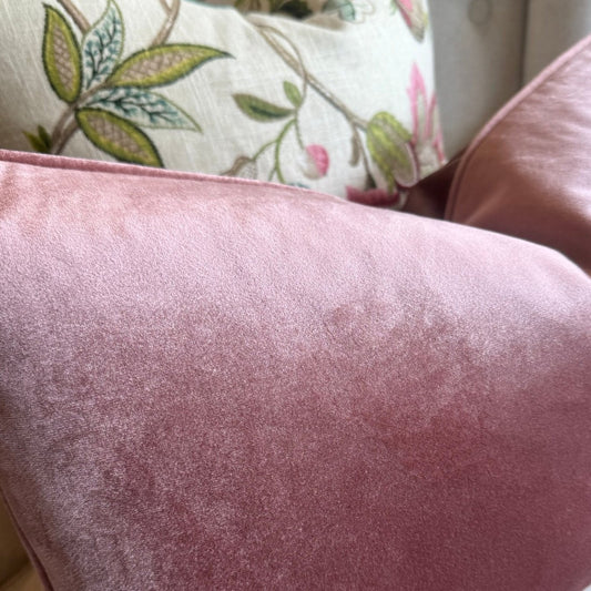 Experience the luxurious softness of our Dusty Pink Velvet Cushion. Elevate any space with style and opulence, featuring a hidden zipper for easy use. Filled with feather inserts for ultimate comfort and conveniently machine washable on a delicate cycle. Its stunning colour is perfect for layering with other cushions on a sofa or in the bedroom.