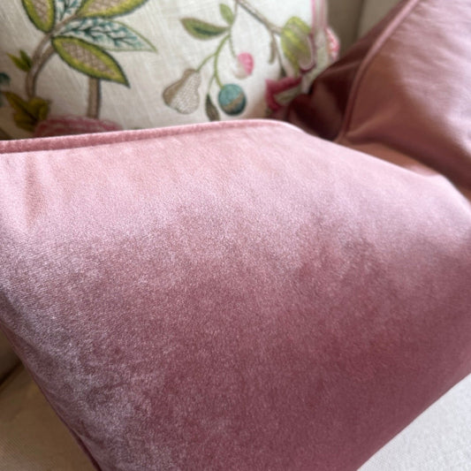 Indulge in the lavish comfort of our Dusty Pink Velvet Lumbar Cushion. Elevate any space with this cushion, adding sophistication and charm. Ideal for creating a plush and stylish feel when paired with other cushions on your couch or bed. Filled with fluffy feather inserts for unparalleled coziness, and easily machine washable with a gentle cycle.