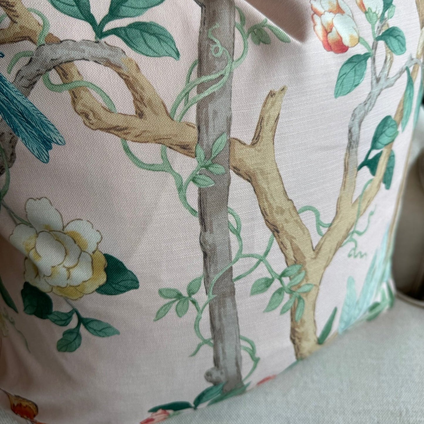 Experience the beauty of nature with this vibrant apricot pink cotton cushion, featuring charming birds, delicate butterflies, and lush botanicals. Add a pop of color to any space and elevate your home decor with this lovely accent cushion, complete with a soft duck feather insert.