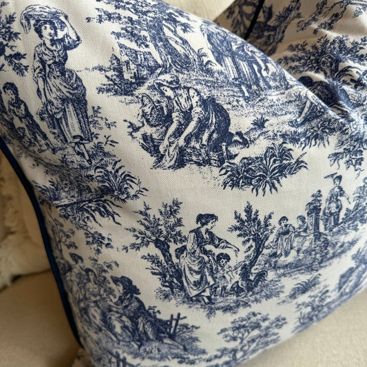 Elevate your living space with the timeless elegance of this classic blue and white toile cushion. The delicate vintage print adds a touch of sophistication, while the bold white background creates a striking contrast. And with its plush duck feather insert, it's the perfect accent piece to add comfort and style to any room.