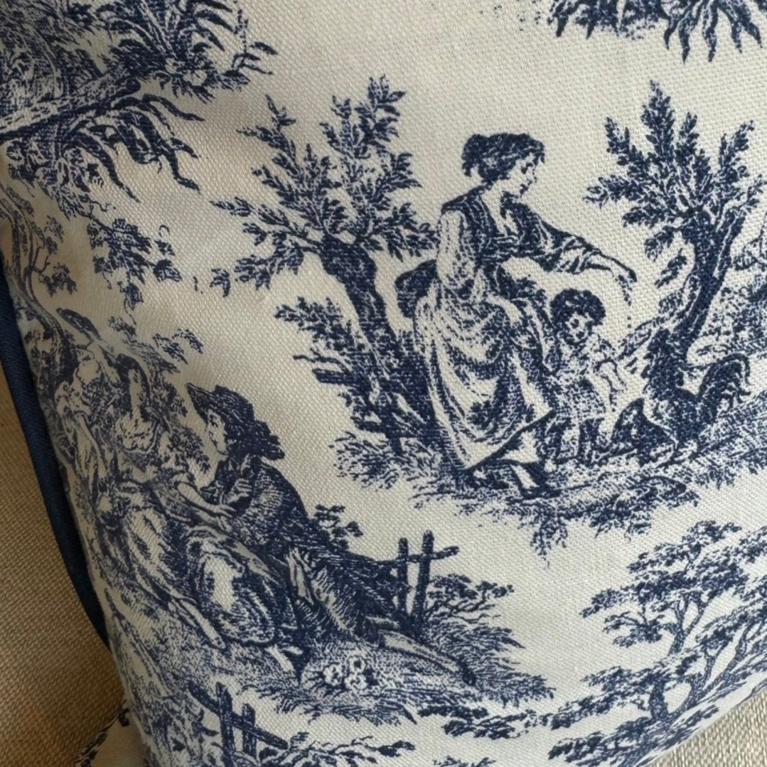 Elevate your living space with the timeless elegance of this classic blue and white toile cushion. The delicate vintage print adds a touch of sophistication, while the bold white background creates a striking contrast. And with its plush duck feather insert, it's the perfect accent piece to add comfort and style to any room.