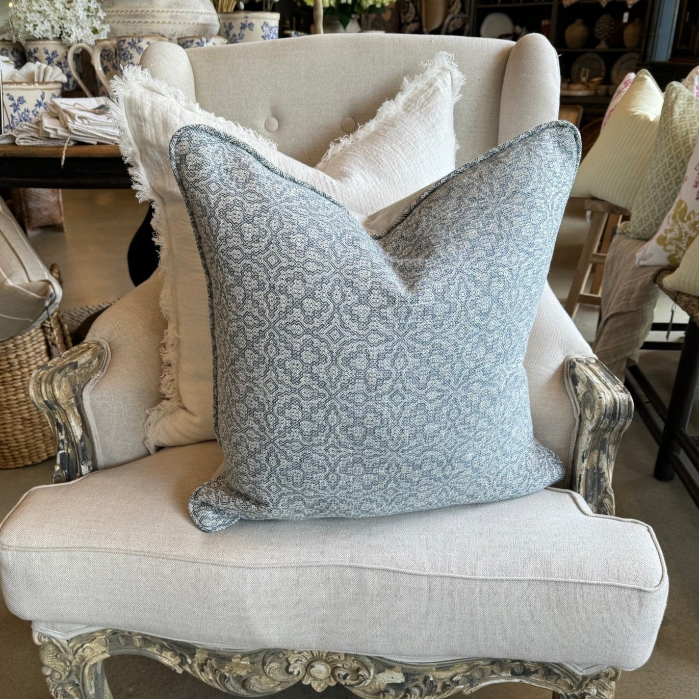 The Lilibet Woven Linen Cushion features a beautiful mixture of dove grey and navy blue patterns, making it a visually stunning addition to any living space. The luxurious feather insert adds an indulgent touch, perfect for those seeking to elevate their home decor. With a subtle pattern, it creates an inviting atmosphere that is both elegant and inviting.