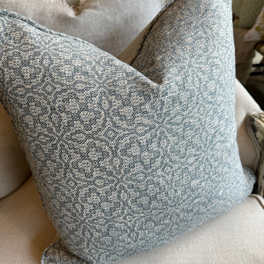 The Lilibet Woven Linen Cushion features a beautiful mixture of dove grey and navy blue patterns, making it a visually stunning addition to any living space. The luxurious feather insert adds an indulgent touch, perfect for those seeking to elevate their home decor. With a subtle pattern, it creates an inviting atmosphere that is both elegant and inviting.