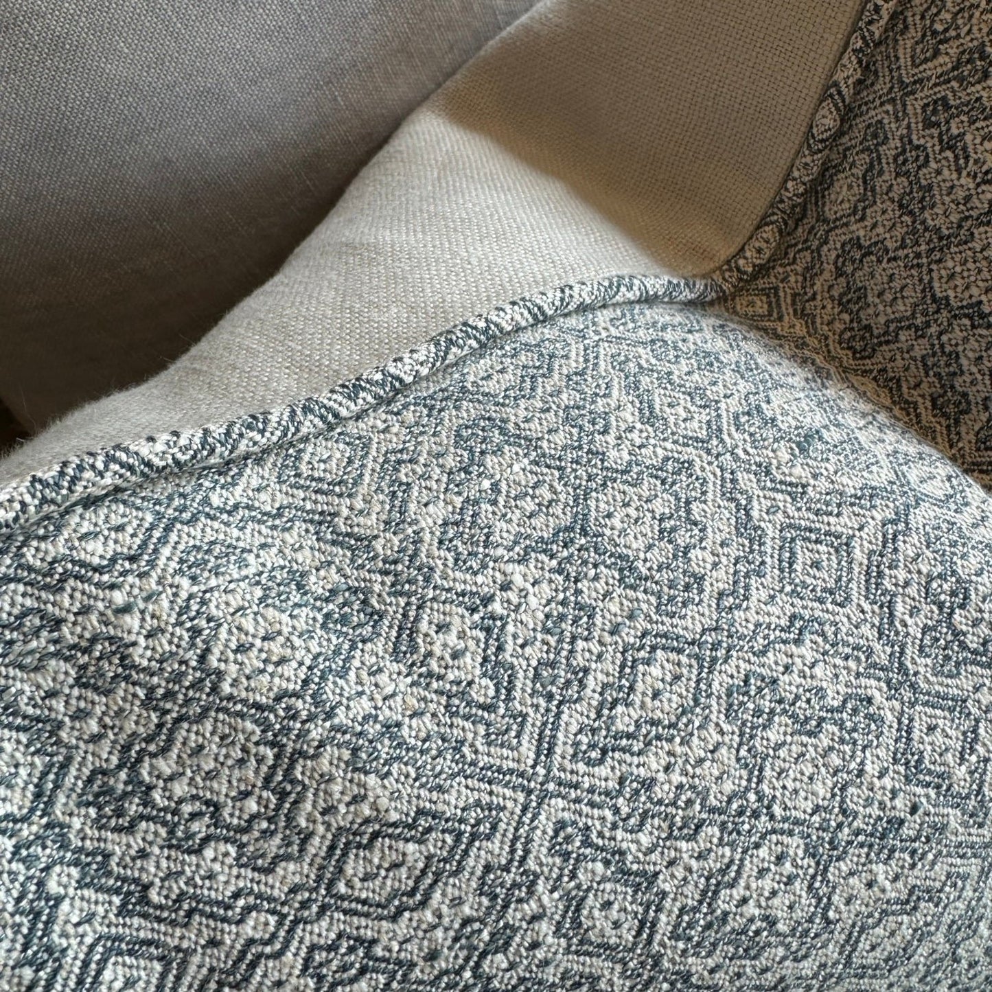 The Lilibet Woven Linen Cushion features a beautiful mixture of dove grey and navy blue patterns, making it a visually stunning addition to any living space. The luxurious feather insert adds an indulgent touch, perfect for those seeking to elevate their home decor. With a subtle pattern, it creates an inviting atmosphere that is both elegant and inviting.