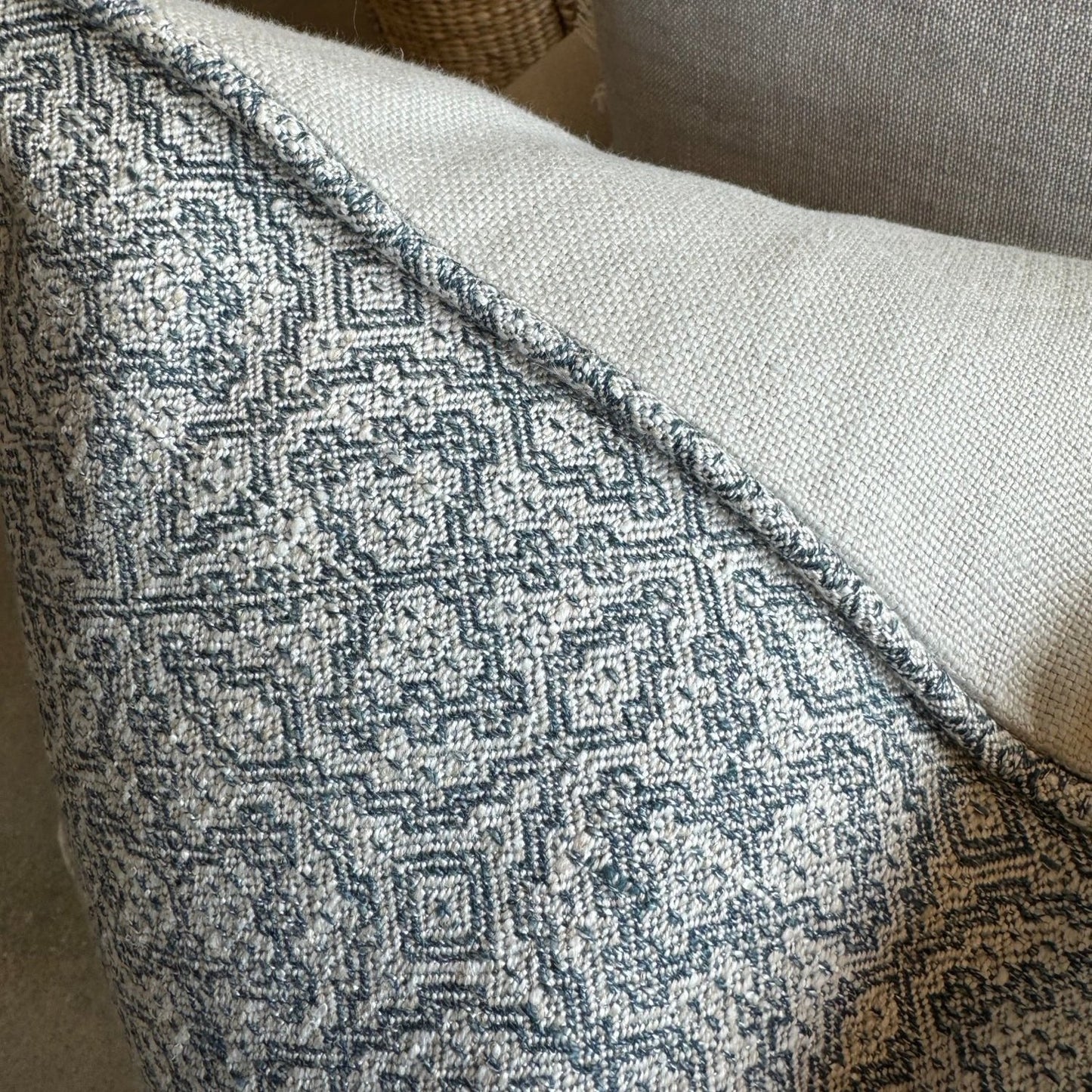 The Lilibet Woven Linen Cushion features a beautiful mixture of dove grey and navy blue patterns, making it a visually stunning addition to any living space. The luxurious feather insert adds an indulgent touch, perfect for those seeking to elevate their home decor. With a subtle pattern, it creates an inviting atmosphere that is both elegant and inviting.