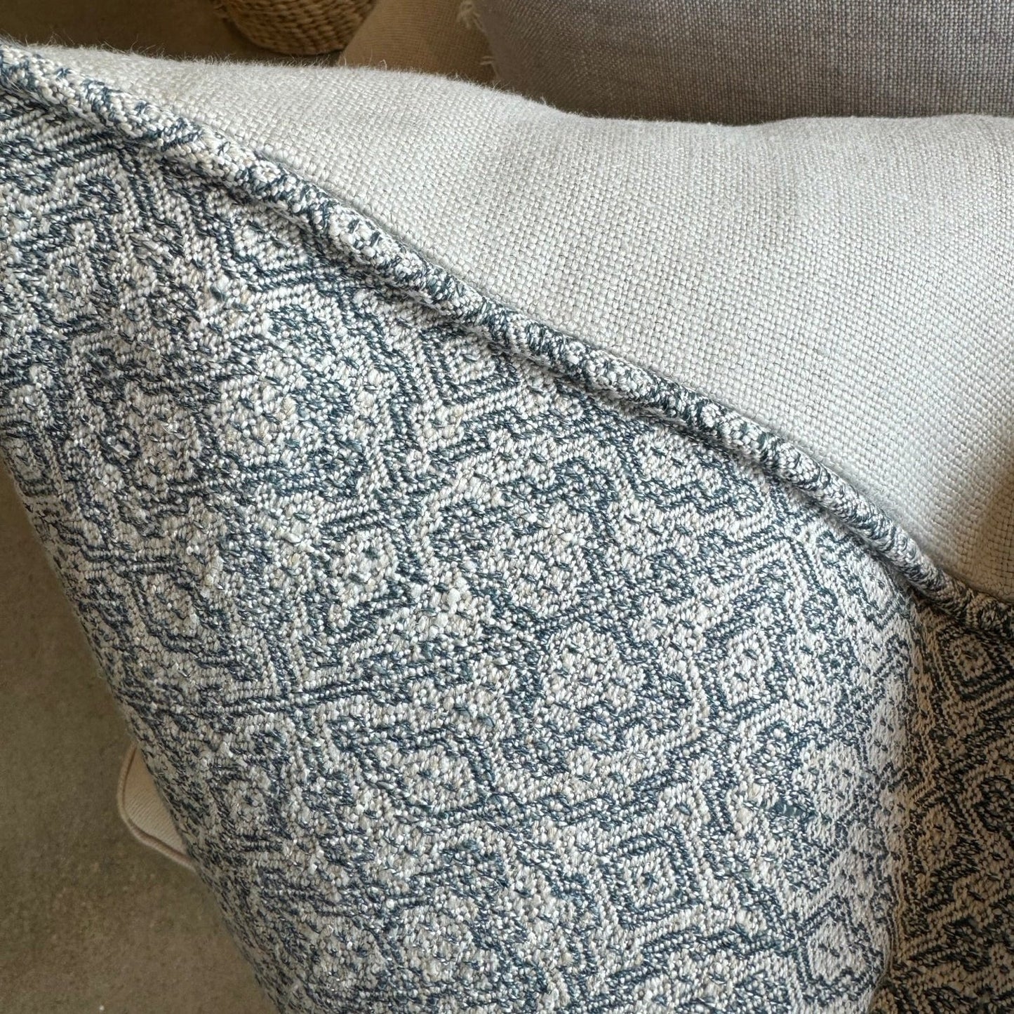 The Lilibet Woven Linen Cushion features a beautiful mixture of dove grey and navy blue patterns, making it a visually stunning addition to any living space. The luxurious feather insert adds an indulgent touch, perfect for those seeking to elevate their home decor. With a subtle pattern, it creates an inviting atmosphere that is both elegant and inviting.