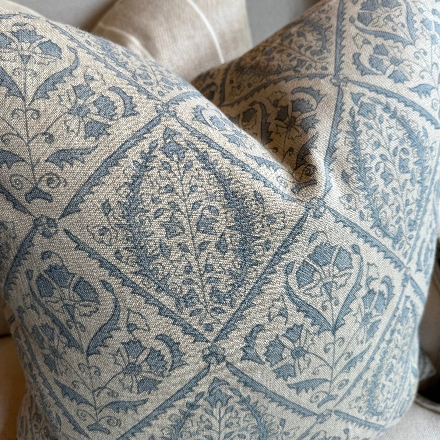Experience the beauty and quality of CHAMOIS' Jaipur Dusty Blue Linen Cushion - a stunning addition to any interior. Meticulously crafted with a striking Indian block print pattern on premium 100% Belgian linen, this cushion exudes luxury and durability. Complete with a plush feather insert, elevate your home decor with this exquisite piece from CHAMOIS.
