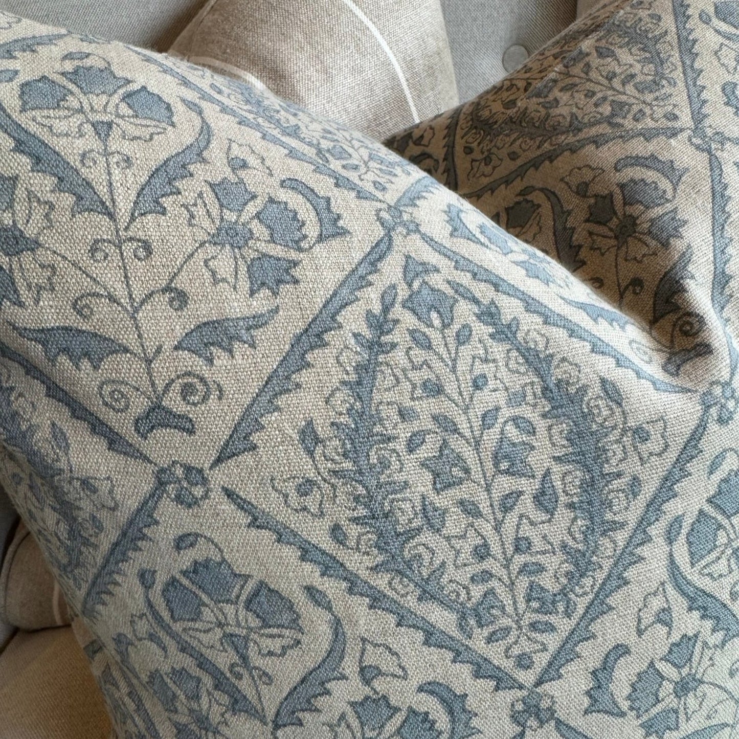 Experience the beauty and quality of CHAMOIS' Jaipur Dusty Blue Linen Cushion - a stunning addition to any interior. Meticulously crafted with a striking Indian block print pattern on premium 100% Belgian linen, this cushion exudes luxury and durability. Complete with a plush feather insert, elevate your home decor with this exquisite piece from CHAMOIS.