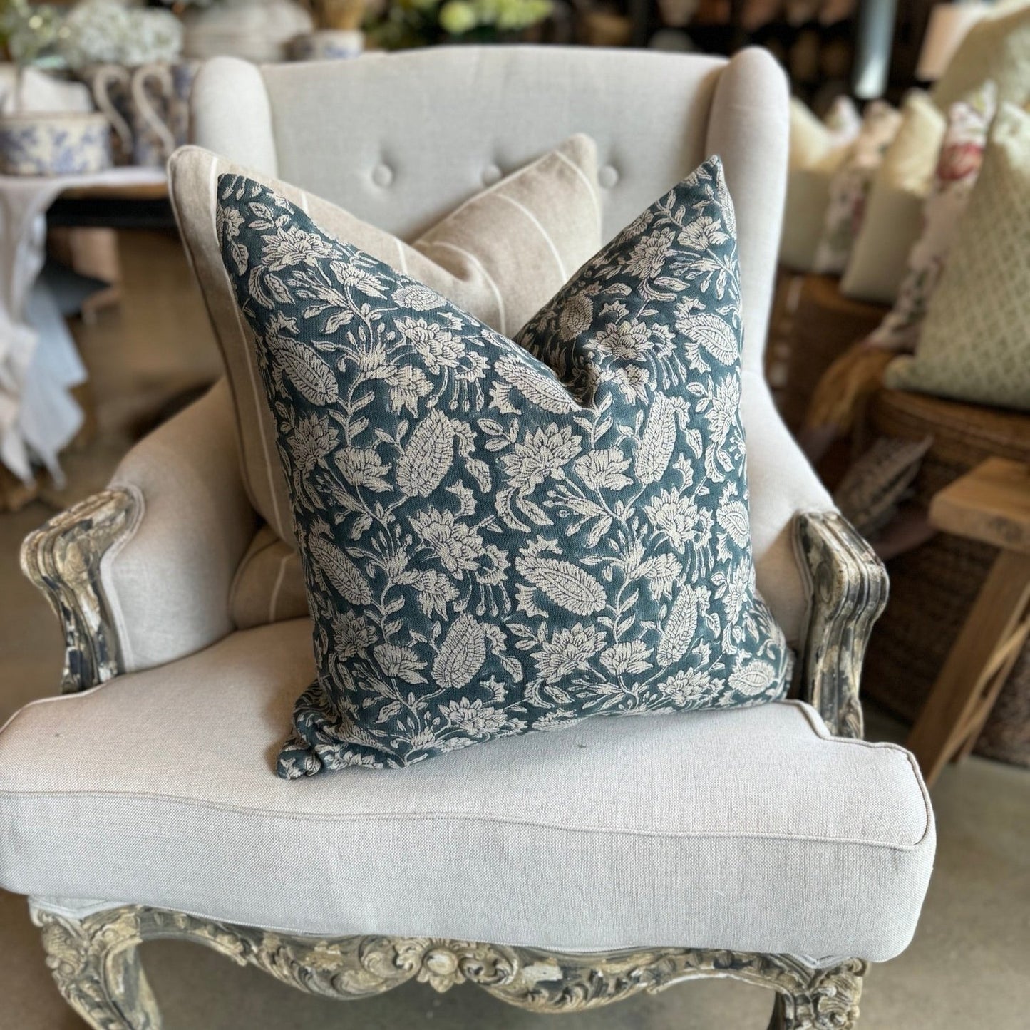 Experience the beauty and quality of CHAMOIS' Jodhpur Denim Blue Linen Cushion - a stunning addition to any interior. Meticulously crafted with a striking Indian block print pattern on premium 100% Belgian linen, this cushion exudes luxury and durability. Complete with a plush feather insert, elevate your home decor with this exquisite piece from CHAMOIS.