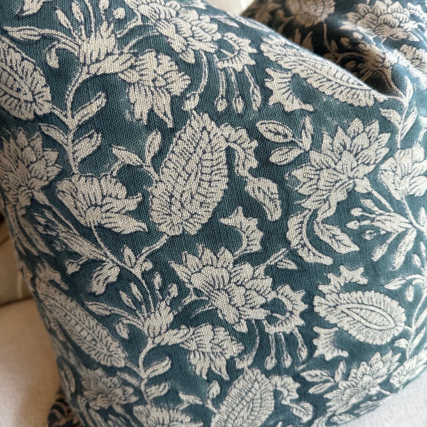 Experience the beauty and quality of CHAMOIS' Jodhpur Denim Blue Linen Cushion - a stunning addition to any interior. Meticulously crafted with a striking Indian block print pattern on premium 100% Belgian linen, this cushion exudes luxury and durability. Complete with a plush feather insert, elevate your home decor with this exquisite piece from CHAMOIS.