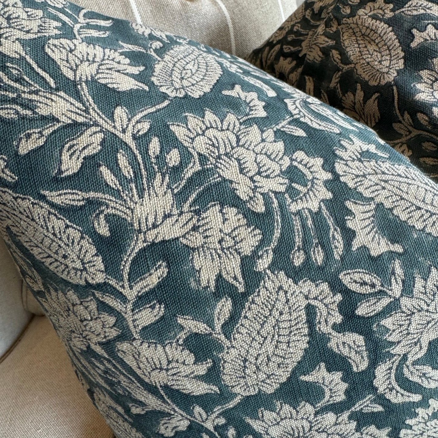 Experience the beauty and quality of CHAMOIS' Jodhpur Denim Blue Linen Cushion - a stunning addition to any interior. Meticulously crafted with a striking Indian block print pattern on premium 100% Belgian linen, this cushion exudes luxury and durability. Complete with a plush feather insert, elevate your home decor with this exquisite piece from CHAMOIS.