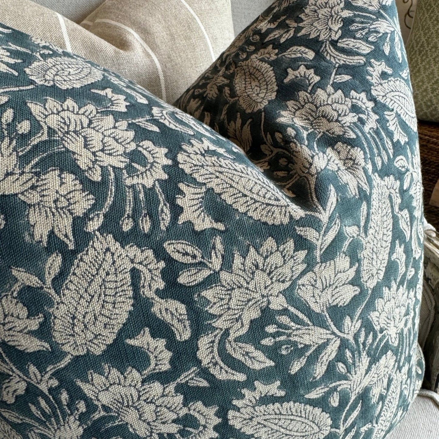 Experience the beauty and quality of CHAMOIS' Jodhpur Denim Blue Linen Cushion - a stunning addition to any interior. Meticulously crafted with a striking Indian block print pattern on premium 100% Belgian linen, this cushion exudes luxury and durability. Complete with a plush feather insert, elevate your home decor with this exquisite piece from CHAMOIS.