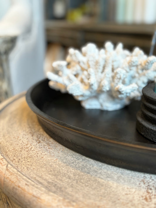 Add a touch of vintage charm to your home decor with the Kara Bronze Round Tray. Its stunning bronze finish and angled lifted edges make it the perfect addition to coffee tables, consoles, or even ottomans. This practical yet elegant accessory will enhance any decorative vignette. detail