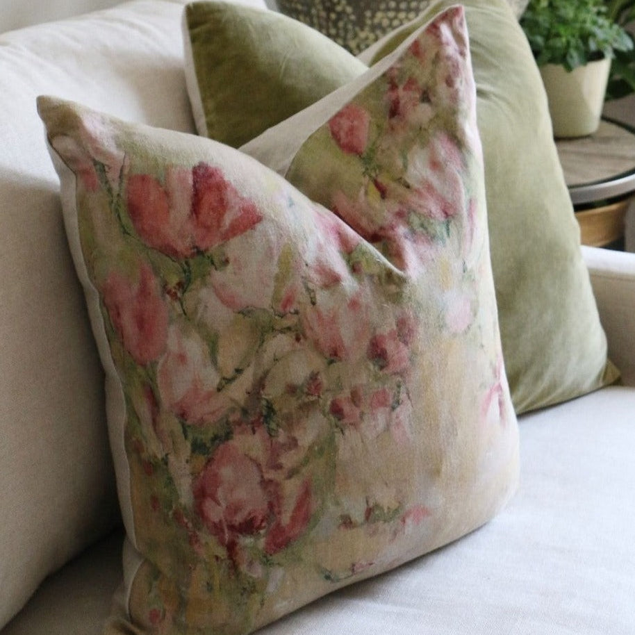The Magnolia Floral Limone Linen Cushion celebrates the beauty of Spring with its vibrant pink magnolia flowers on a 100% linen background. An ideal addition to any home, this cushion is perfect for bringing life and style to any room. Comes complete with a luxurious feather filled insert. Side.