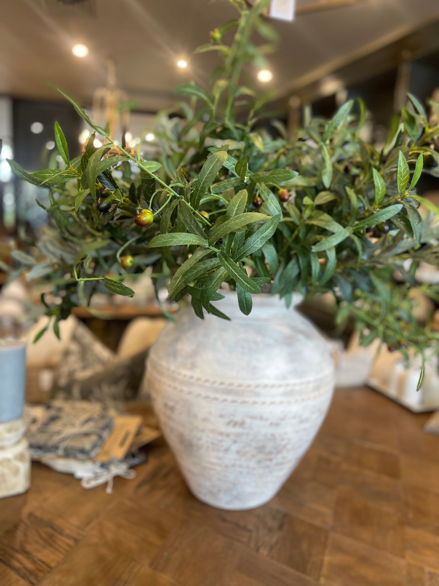 A classic symbol of tranquillity, our Faux Olive Branch adds a genuine feel to any space. Realistic foliage, stems, and branches will present a fresh look, even in the busiest of environments. Craft the perfect touch of green with our branch in a pot or vase, offering a timeless look for any area in your home. Styled.