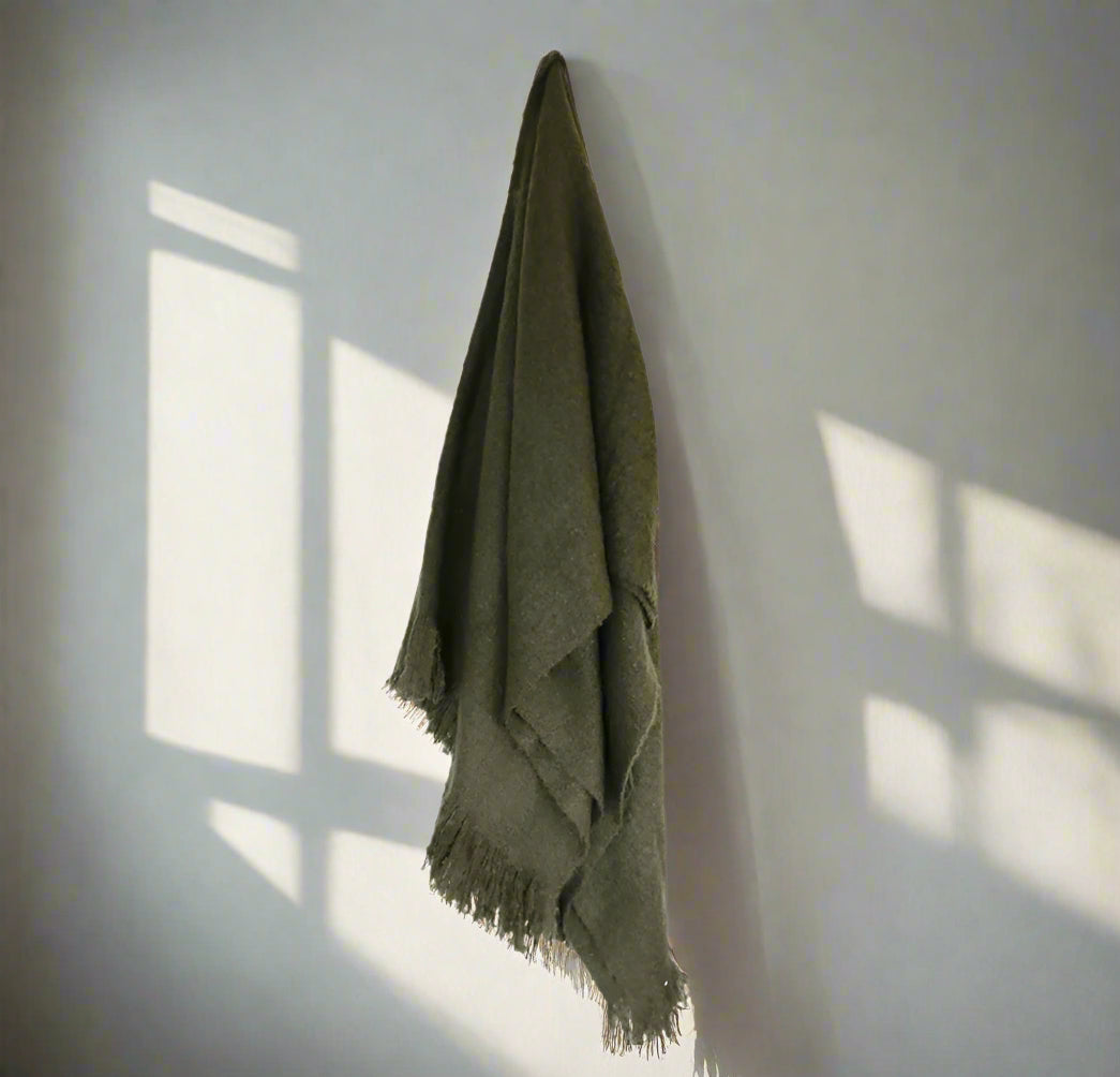 Elevate the comfort and appearance of your bed or couch with the luxurious Otago Dark Green Throw. Indulge in ultimate coziness as the lush texture and fringe detailing add character and warmth to any space. This throw is the perfect complement to any fabric and is guaranteed to create a welcoming ambiance. Crafted from acrylic, it offers both durability and style.