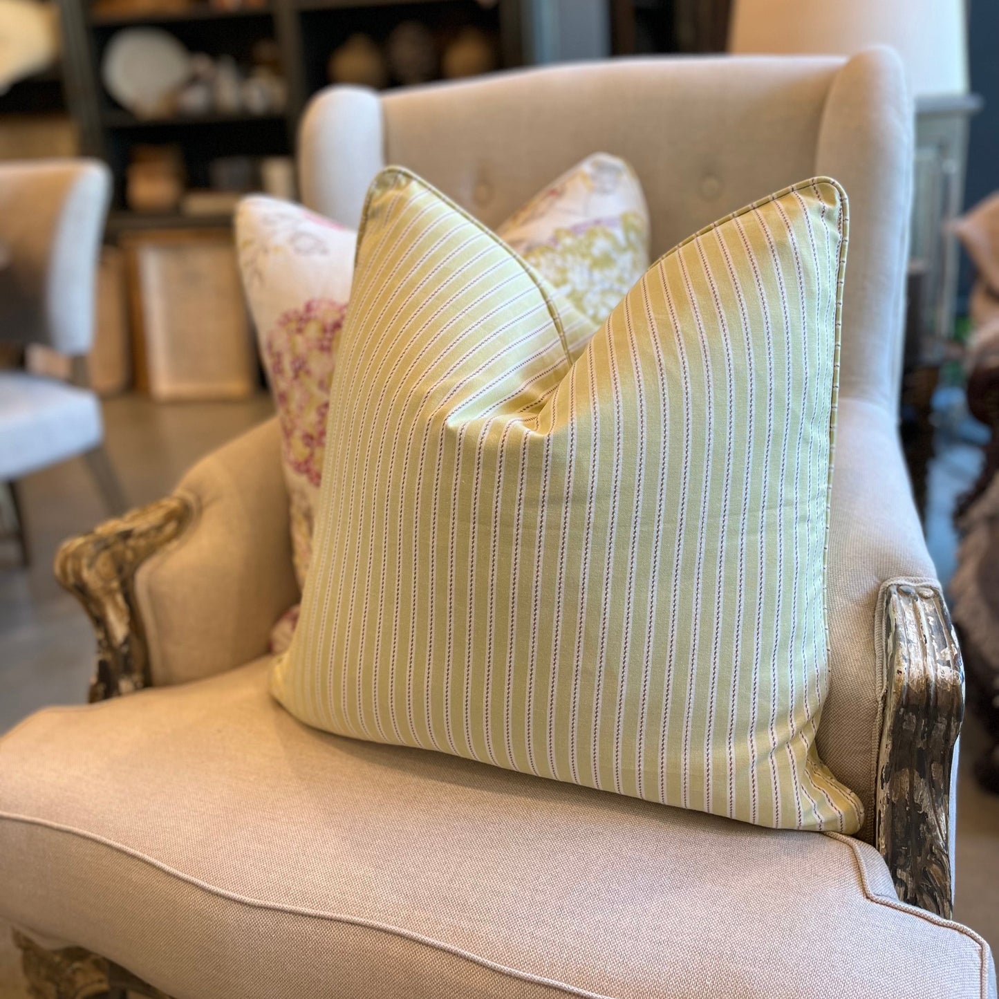 Experience unbeatable comfort with the adorable Penelope Cotton Ticking Stripe Cushion! Featuring a subtle ticking stripe and a playful pastel lime color, this cushion is sure to add a touch of fun to any space. Complete with a feather insert, it's the perfect combination of style and coziness. Front