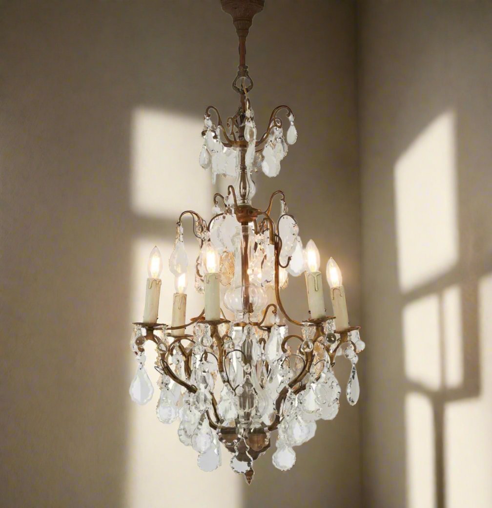 Indulge in timeless elegance with the Lyon Chandelier. This 6-light fixture, crafted from high-quality brass, features a traditional form with graceful elongation. A stunning focal point for both classic and modern spaces, this exquisite chandelier beautifully combines brass cast iron with sparkling crystal in a truly baroque style. Elevate your interior space with this French classic, the ultimate statement piece in glass and brass.