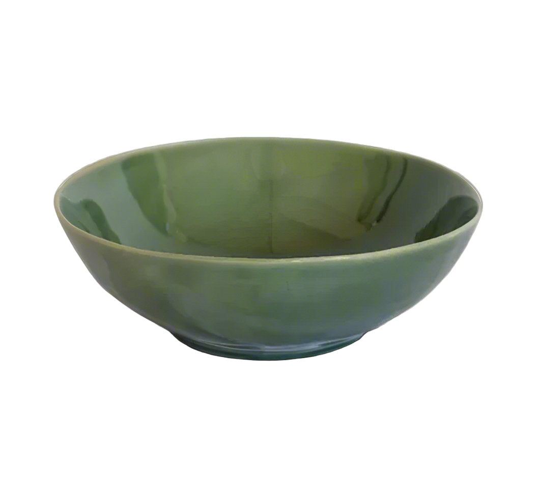 The Glazed Verde & Ivy Salad Bowl boasts a unique, organic shape and texture. The stoneware bowl features a deep green glaze, yielding a timeless aesthetic. Enjoy its distinctive beauty with unique variations in texture and colour. Ideal as a large serving bowl or fruit bowl, this piece exudes organic beauty.