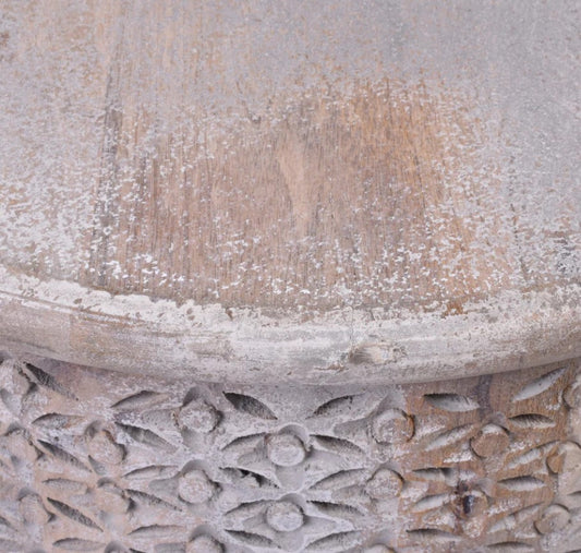 The Anais Carved Side Table is crafted from durable hardwood timber, with a unique circular shape and intricate hand-carved detailing. This exquisite piece exudes a timeless Boho vibe and is beautifully enhanced with a rustic grey wash for a rustic touch. Corner