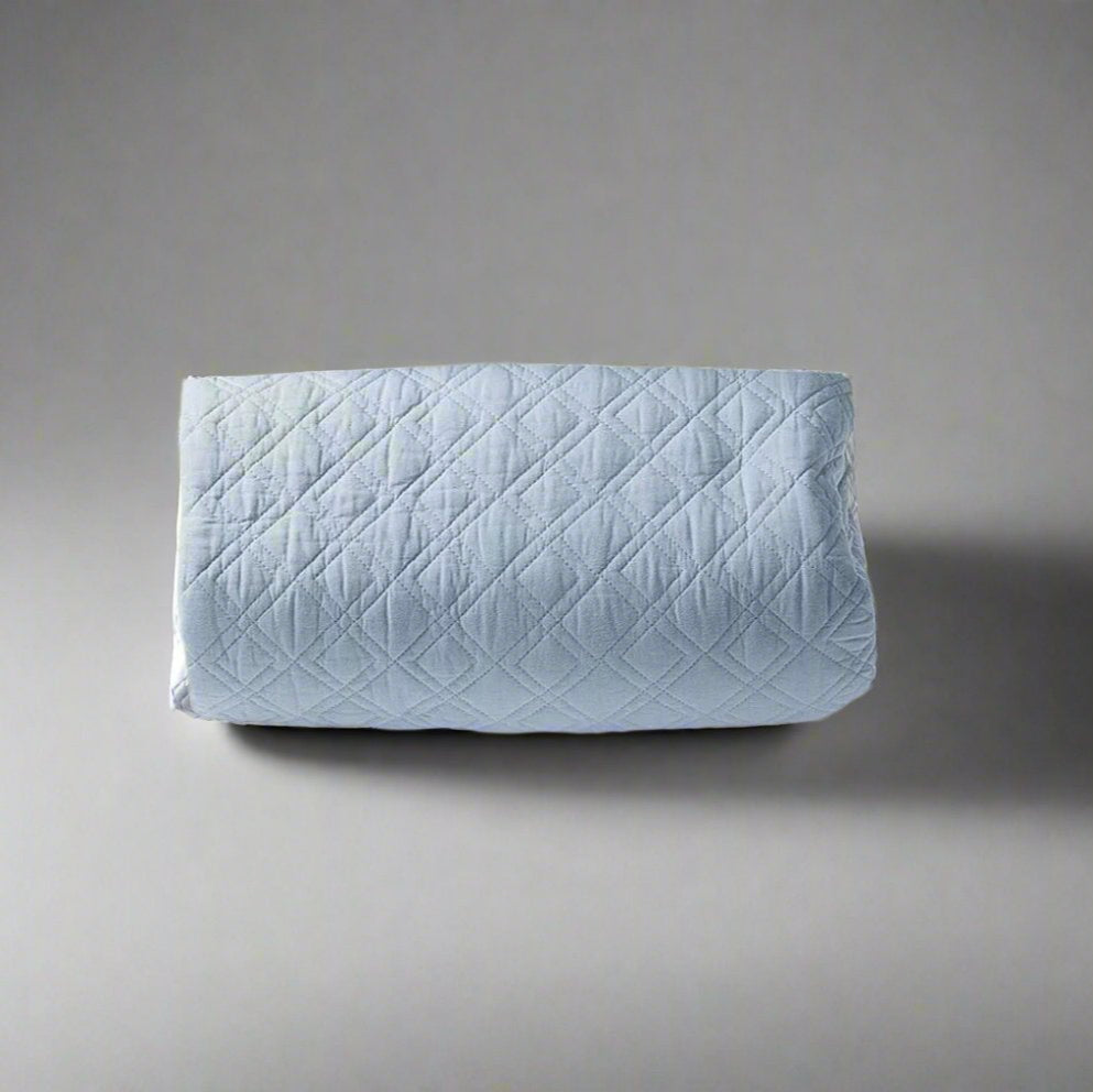 The Marseilles Double Diamond 100% cotton quilt exudes both comfort and style. Featuring an elegant soft blue tone and timeless pattern with intricate cross stitching, it's sure to add a touch of elegance to your bedroom. Crafted with soft and luxurious 100% cotton fabric and wadding, it's also conveniently machine washable on a delicate cycle.
