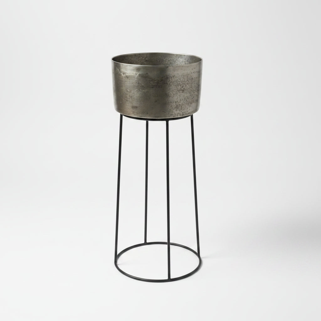 Add a touch of elegance to your gatherings with the Amoy Standing Wine Bucket Large. Its sleek black iron base and antique silver bucket, which can hold up to 4 bottles, make for a convenient and stylish way to serve your favourite wines.