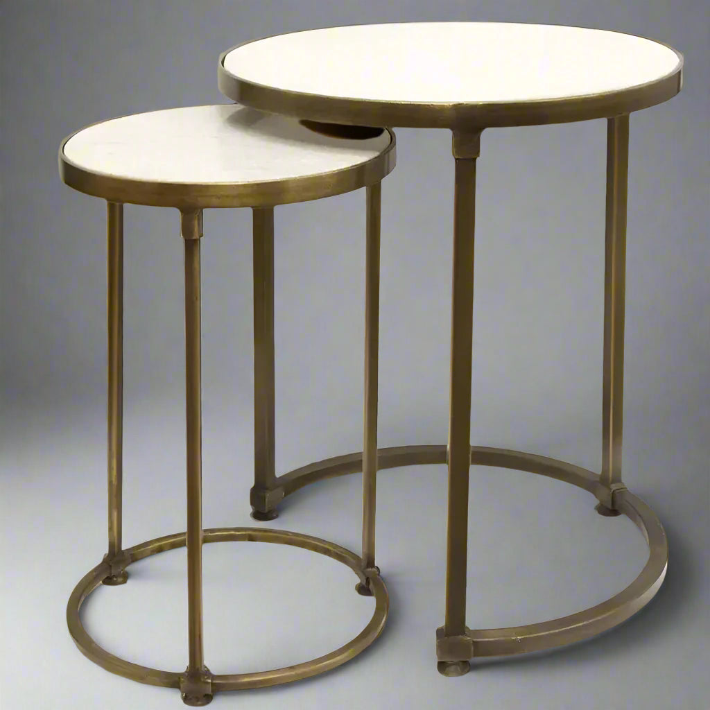 Experience the exquisite craftsmanship of these Round Gold Nesting Tables (2PC). Crafted from high-quality iron and marble, their beautiful matt gold finish adds an elegant touch to any room. Plus, the smaller table conveniently slides under the larger one, making them perfect for small spaces.