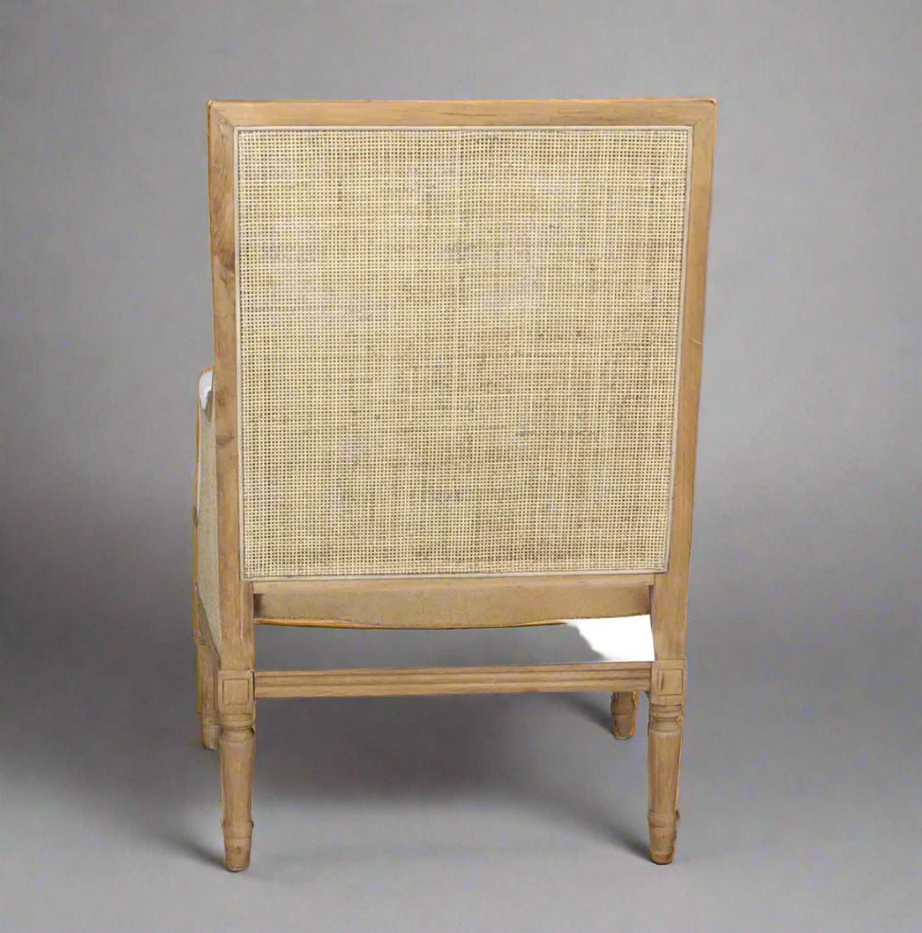 Experience the classic elegance of the Hicks Oak & Rattan Armchair featuring a beautiful carved oak frame, natural rattan back, and soft cotton white upholstery. The plush, removable seat and back cushions make it ideal for any living room or bedroom. Elevate your home decor with this essential piece that offers both style and comfort.