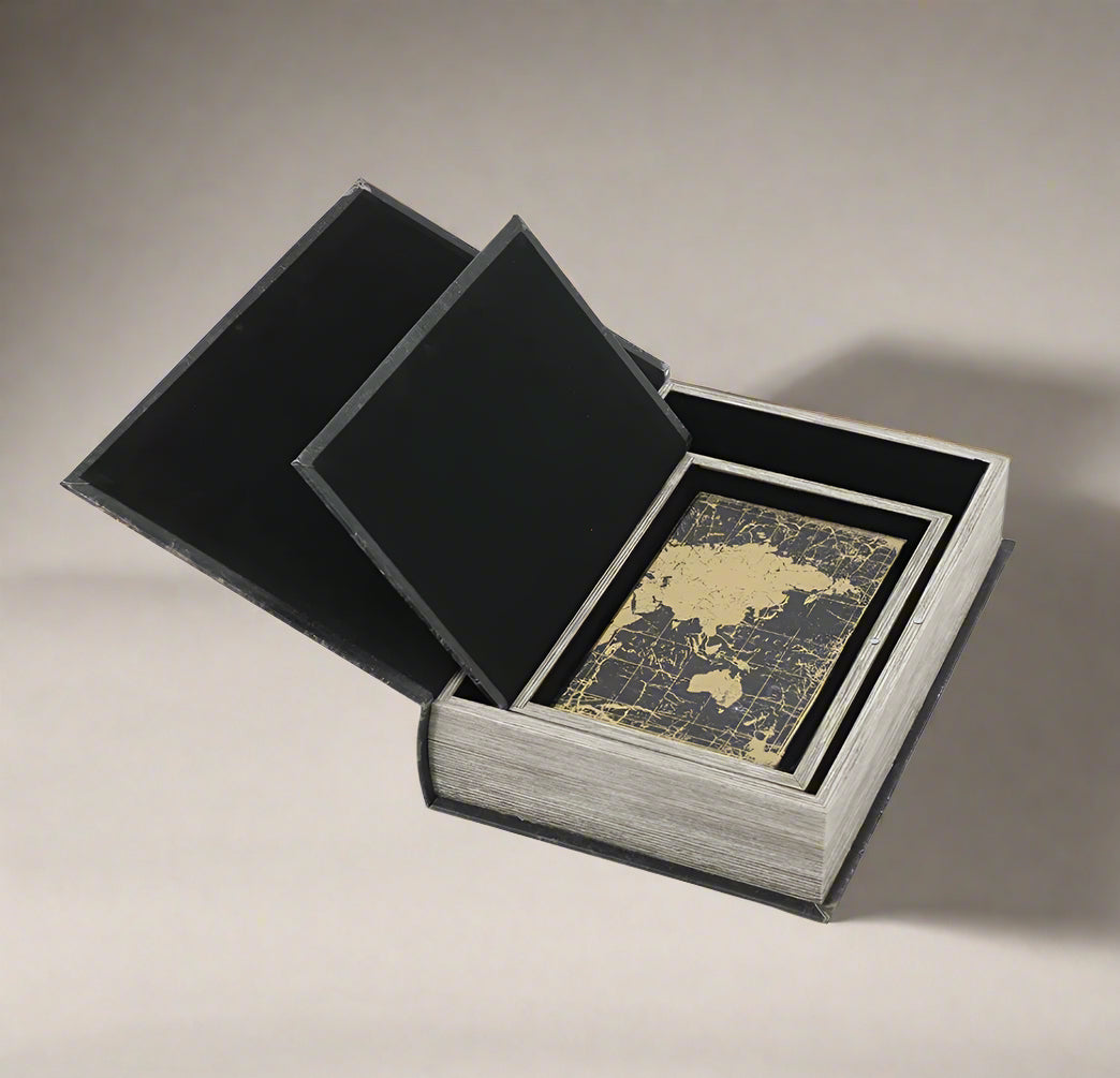 Add a luxurious touch to your home decor with our Set of 3 World Map Faux Books. These traditional-inspired pieces elevate any room with their elegance. Spruce up your bookshelf, living room, or entryway with these stylish and practical additions.