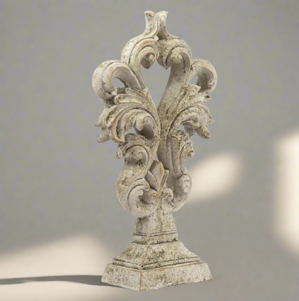 Experience the elegance and sophistication of the Crested Heart Distressed Decorative Object. With its sculptural design and subtle palette, this decorative piece made from cement is finished with a cream distressed effect. Perfect for adding personality to your decor, it will bring a touch of artistic charm to any built-ins or side table vignettes. 