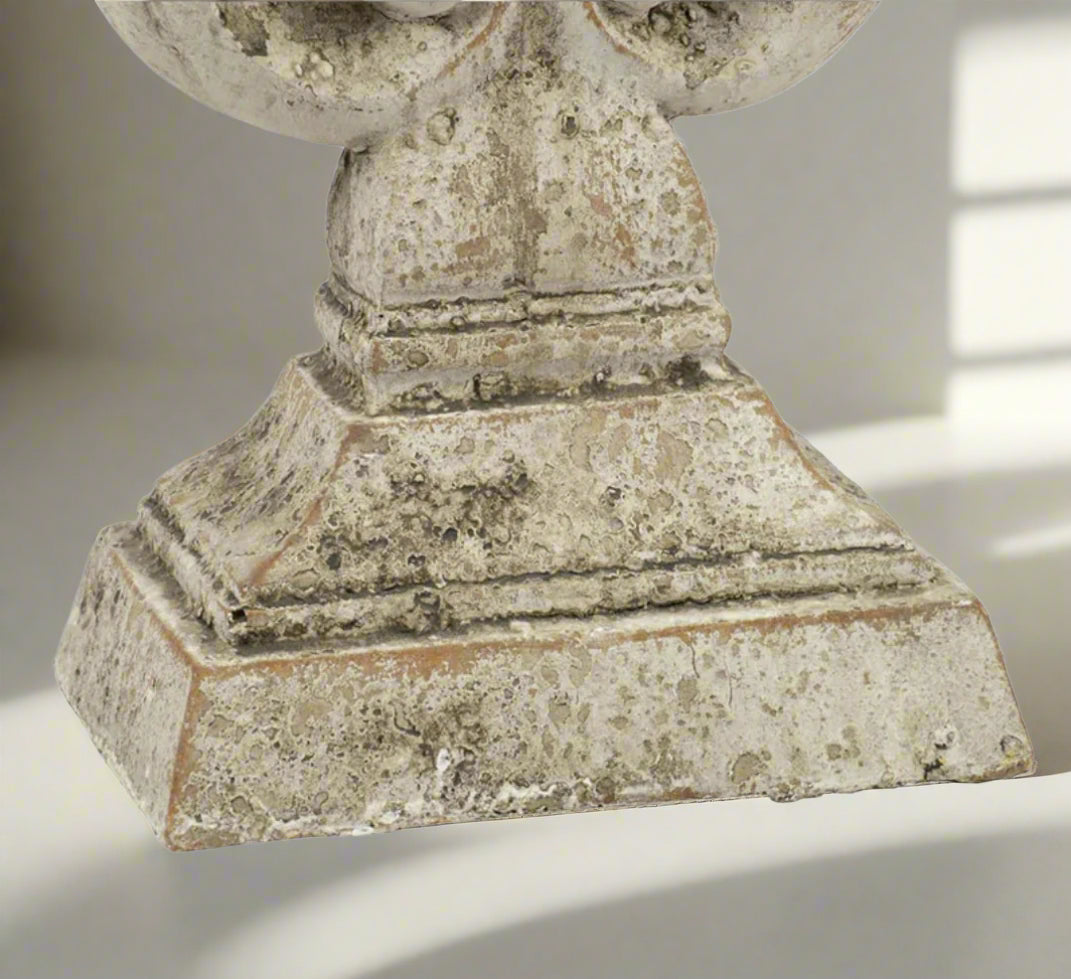 Experience the elegance and sophistication of the Crested Heart Distressed Decorative Object. With its sculptural design and subtle palette, this decorative piece made from cement is finished with a cream distressed effect. Perfect for adding personality to your decor, it will bring a touch of artistic charm to any built-ins or side table vignettes. 