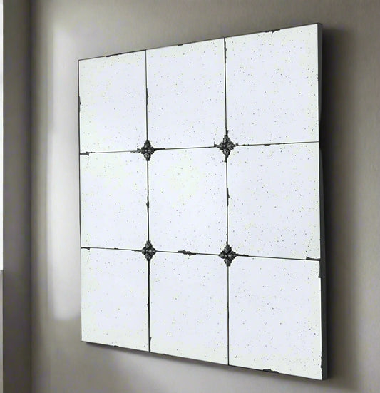 Discover the rustic and romantic charm of the Odette Antique Glass Panel Square Mirror. Featuring heavily antiqued glass panels and resin flower pattern hardware, this mirror exudes vintage elegance. Each panel has a unique hue, creating a composition that is both subtle and mesmerising.