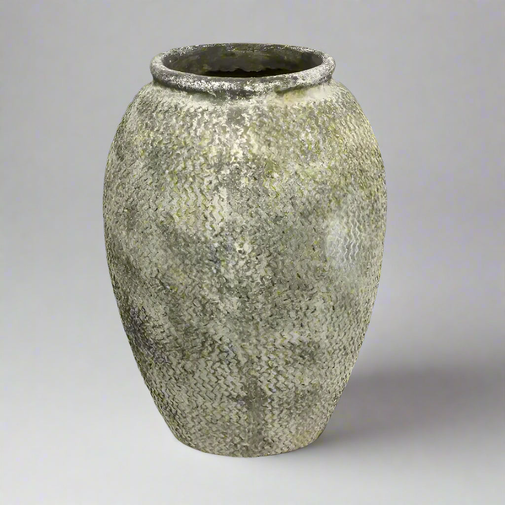 Elevate any space with the Clara Weathered Pot. Its antique design, aged appearance, and intricate zigzag detailing add a rustic charm to both interior and exterior areas. Made from cement, it is perfect for indoor placement.