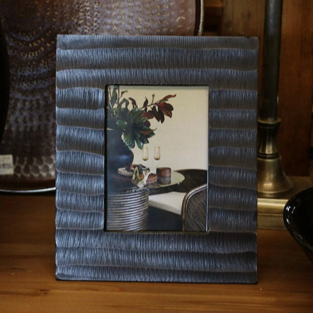 Capture your most cherished memories in style with the Winston Antique Brass Finish Photo Frame. This exquisite frame boasts a timeless sophistication and can be displayed in portrait or landscape orientation for ultimate versatility. Made from high-quality aluminium, this frame features a stunning dimpled antique brass finish that adds a touch of elegance to any room.