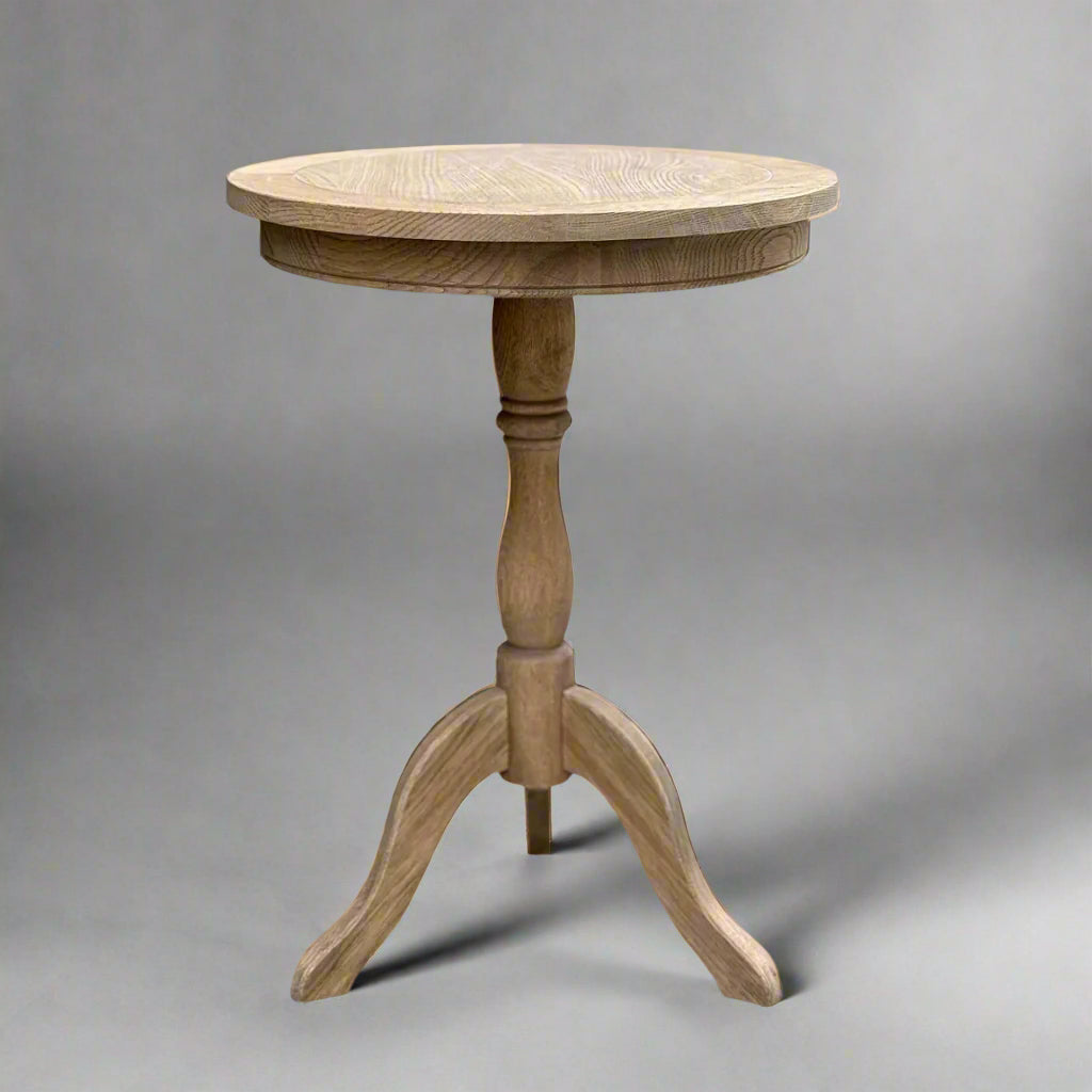 Experience timeless beauty in simplicity with the Provence Weathered Oak Side Table. Handcrafted from solid oak, this versatile piece is perfect for any living room or bedroom. Featuring a round table top and a carved base column, it adds warmth and organic charm to any space.