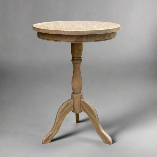 Experience timeless beauty in simplicity with the Provence Weathered Oak Side Table. Handcrafted from solid oak, this versatile piece is perfect for any living room or bedroom. Featuring a round table top and a carved base column, it adds warmth and organic charm to any space.