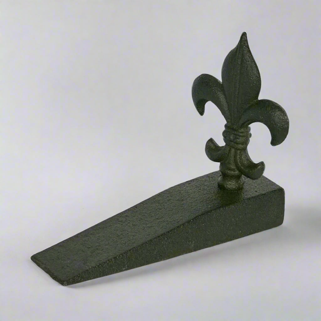 Introducing the Fleur Door Stop Crafted to elevate classic style and add a timeless country charm, this door stop seamlessly blends rustic elegance into your home. Whether gracing your entryway, bedroom, or living room, this functional yet stylish piece is the perfect solution to keep your doors in check, while also serving as a unique decorative accent.