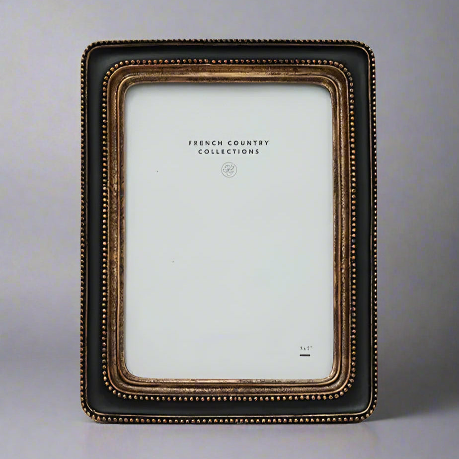 This elegant Beaded Black & Gold Photo Frame showcases a classic black and gold beaded pattern, bringing a sense of warmth and sophistication to any space. Its timeless design perfectly enhances your treasured photos or artwork, making every memory stand out beautifully.