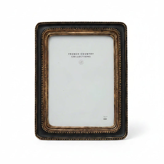 This elegant Beaded Black & Gold Photo Frame showcases a classic black and gold beaded pattern, bringing a sense of warmth and sophistication to any space. Its timeless design perfectly enhances your treasured photos or artwork, making every memory stand out beautifully.