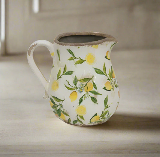 Create a Mediterranean atmosphere in any environment with theSicily Lemon Botanical Stoneware Jug. Handcrafted from durable stoneware and intricately adorned with a delightful lemon pattern, this jug adds a unique and inviting element to indoor and outdoor spaces alike.