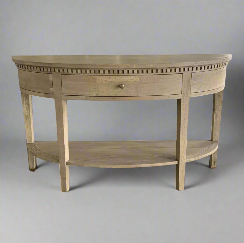 Experience the timeless beauty of the Claude Weathered Oak Curved Console Table. Crafted from solid oak and oak veneer in a stunning weathered oak finish, this table is perfect for any hallway, living room, or bedroom. It features a single dovetailed drawer with a sleek brass handle, adding both functionality and a touch of elegance.