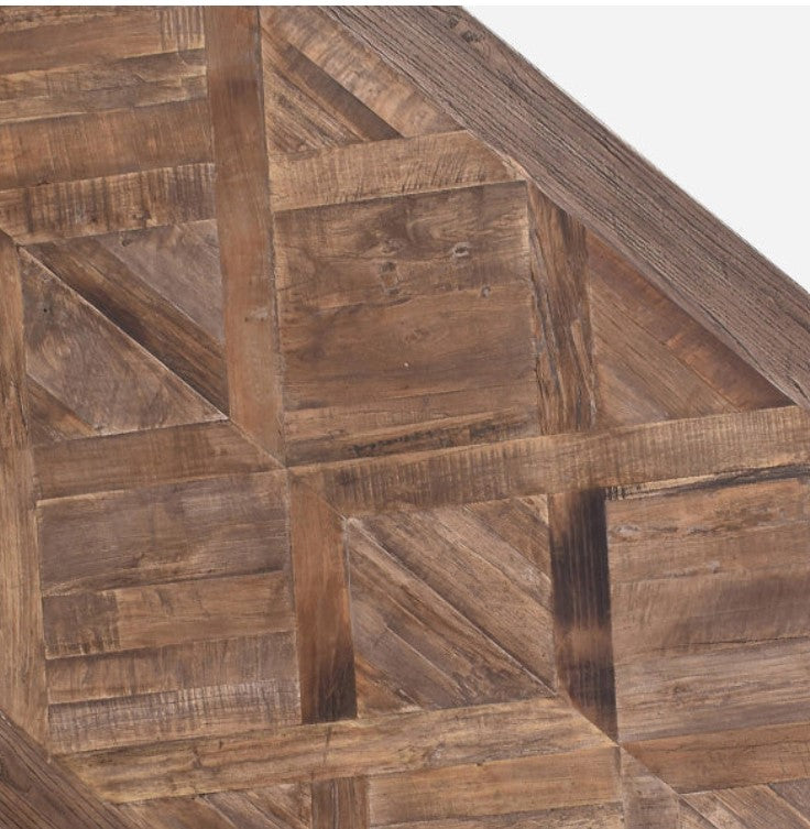 Elevate your dining experience with the Sophia Parquet Elm Dining Table - 200cm. Crafted from high-quality, recycled elm timber, this table boasts both sustainability and timeless elegance. Its unique parquetry design and sturdy pedestal base make it a visually striking and stable addition to any dining space. With ample room for family and friends to gather and enjoy unforgettable meals, this table also promotes eco-consciousness through repurposing materials. Elm timber, known for its distinctive grain pa