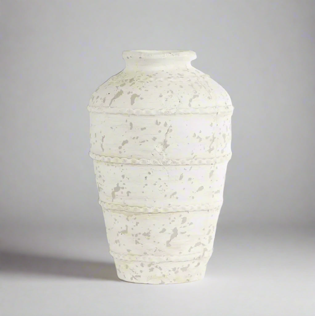 Discover the beauty of terracotta with the Cyprus Rustic Whitewashed Vase. Its distressed surface, paired with a white wash finish, adds charming character to any space. Use it to display your favourite flowers, branches, or greenery on a table, sideboard, or bookcase, or let it shine as a captivating statement piece in any room.