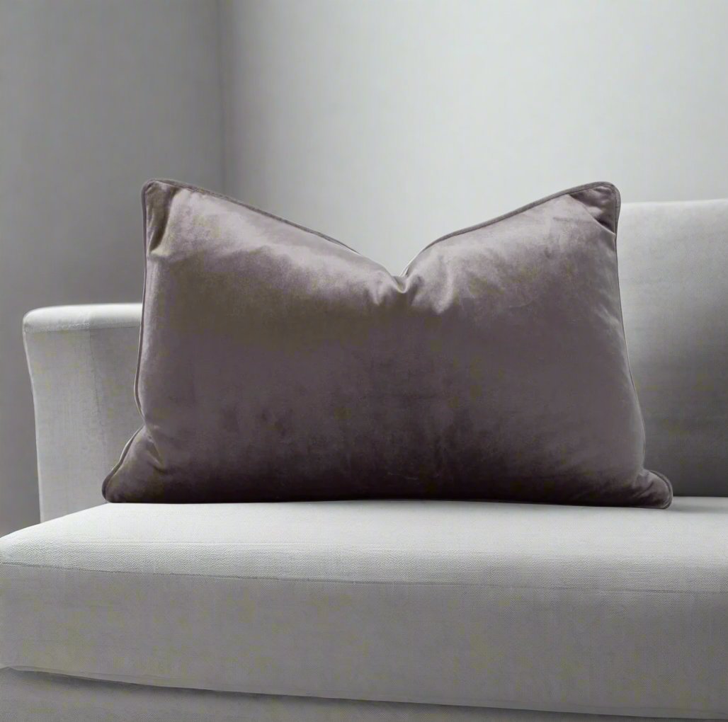 Indulge in the softness of our Steel Grey Velvet Lumbar Cushion 35cm x 55cm. This cushion adds style and luxury to any space, and comes with a concealed zipper for easy use. Filled with feather inserts for ultimate comfort and machine washable on a delicate cycle.