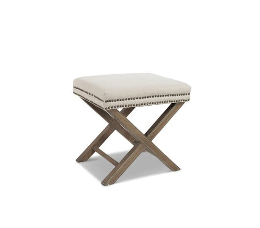 The Winston Ottoman provides a timeless design featuring an upholstery of natural-colored linen and brass studs, set upon white-washed ash wood legs. Perfect for the foot of a bed or near a side table, the light palette of the fabric and timber wash easily complements any room. Front